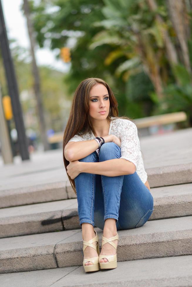 Young woman, wearing casual clothes, with long hair photo