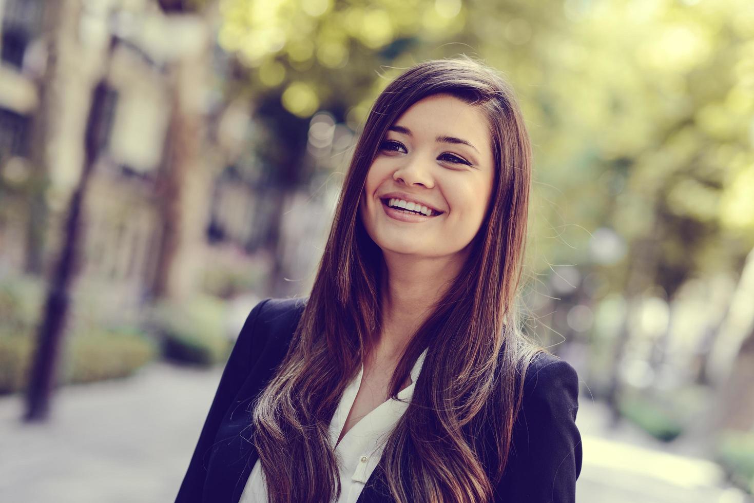 Japanese business woman in urban background photo