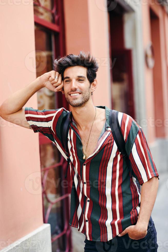 Smiling young man with dark hair and modern hairstyle wearing casual clothes outdoors 5888578 Stock Photo at Vecteezy Smiling young man with dark hair and modern hairstyle wearing casual clothes outdoors 5888578 Stock Photo at Vecteezy