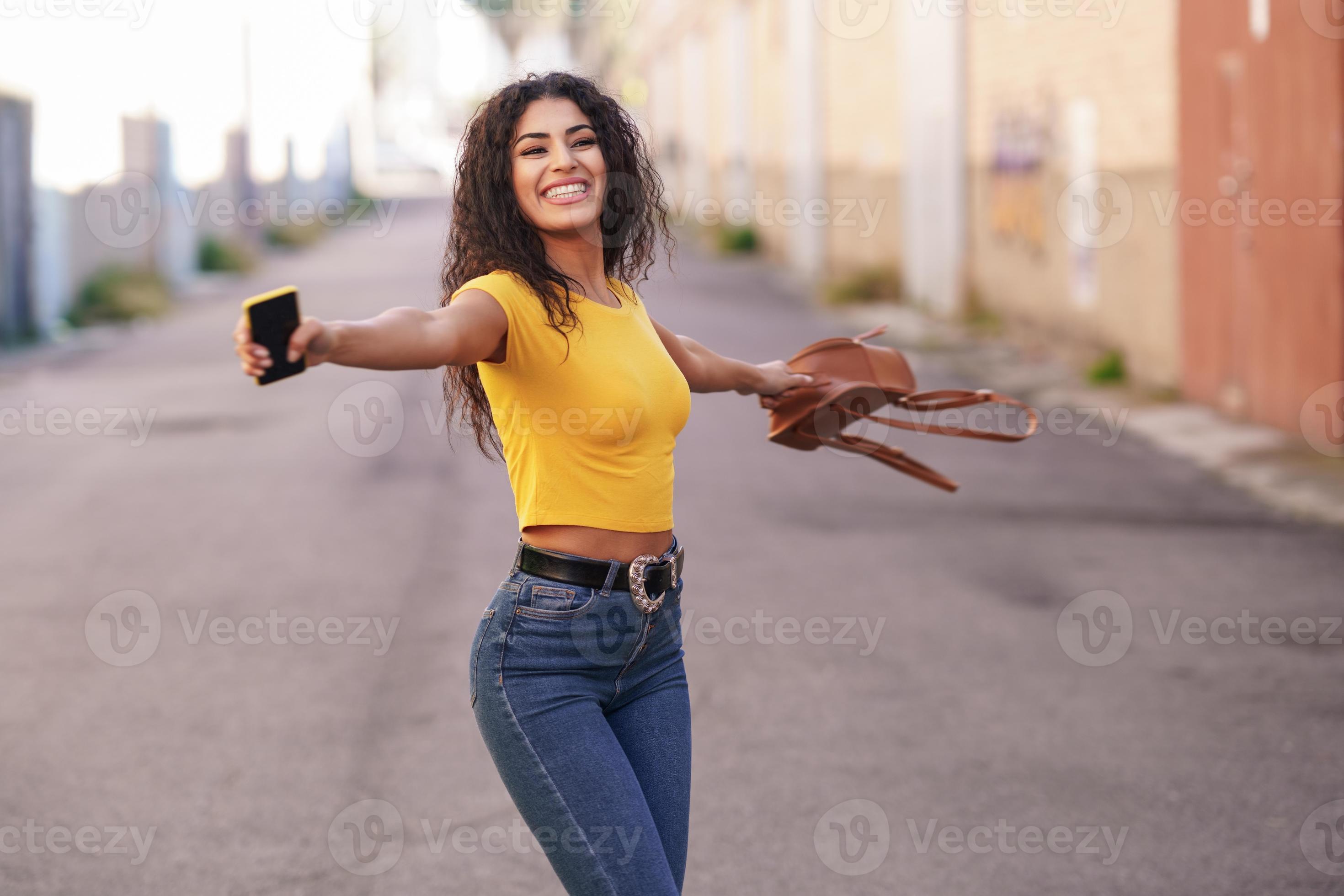 Happy Arab woman with open arms in the street. 5888807 Stock Photo at  Vecteezy