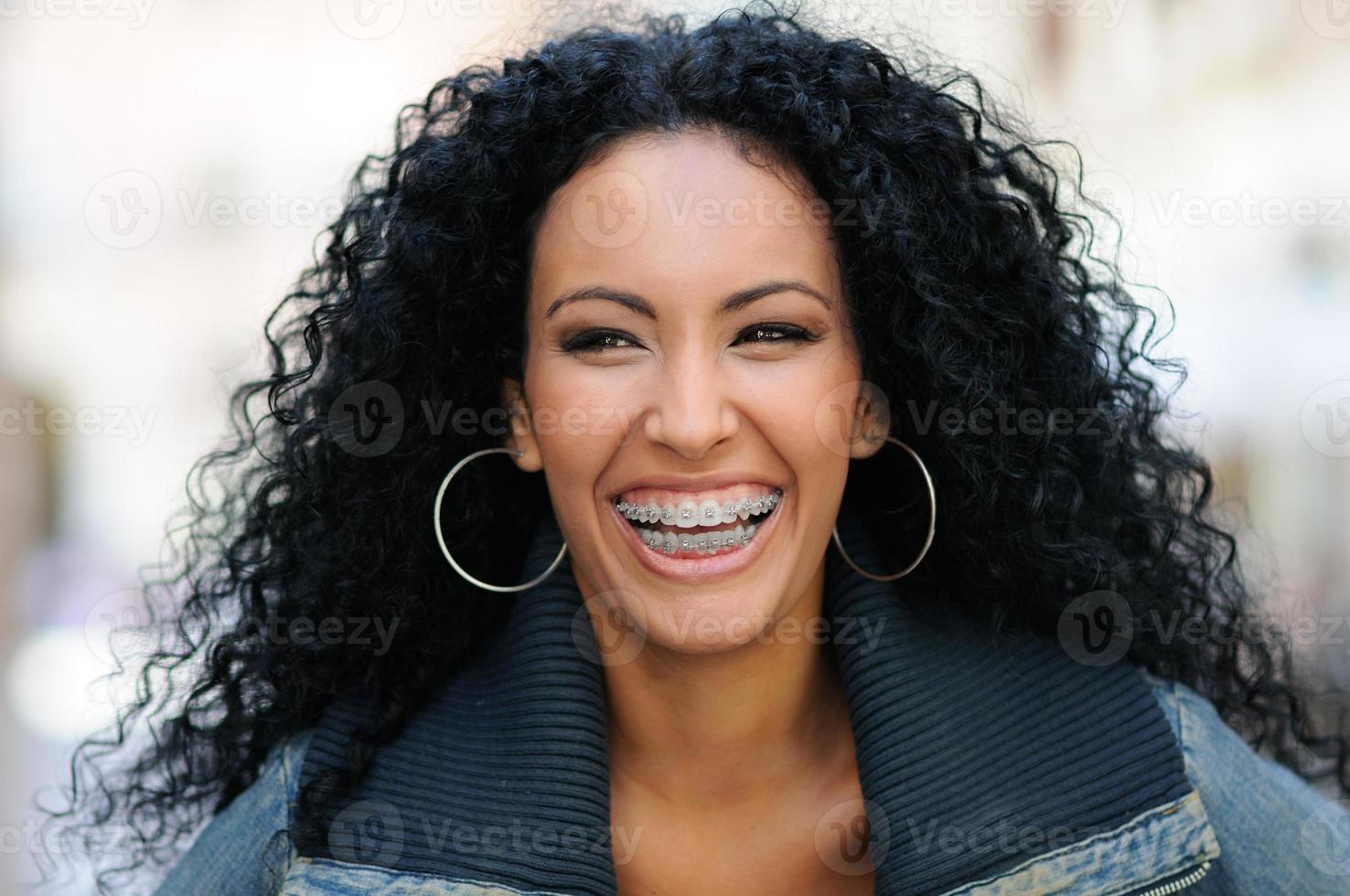 Young black woman smiling with braces photo