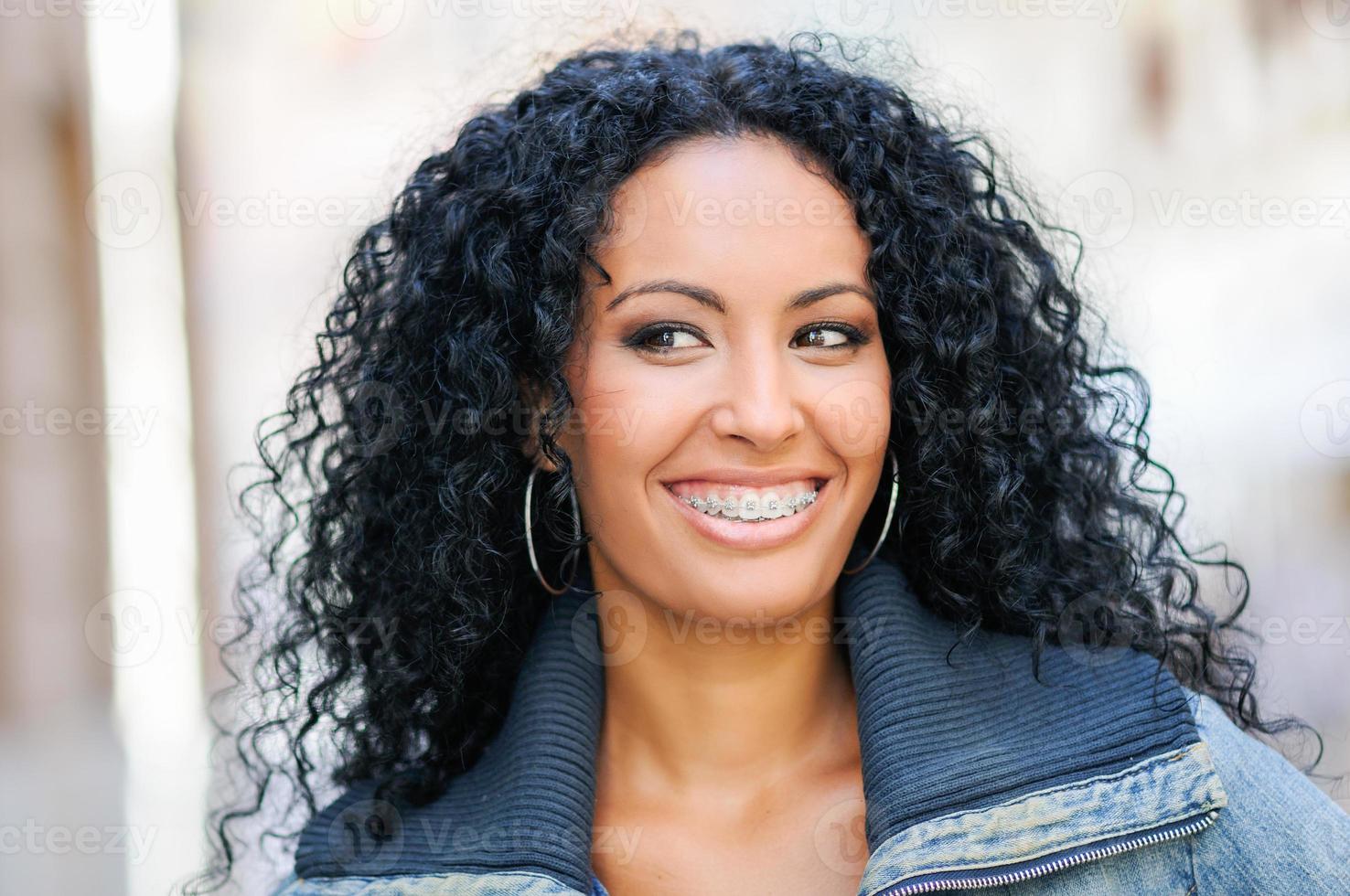 Young black woman smiling with braces photo