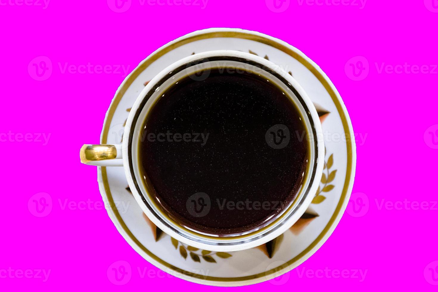 White cup of coffee on vintage wood. Top view photo