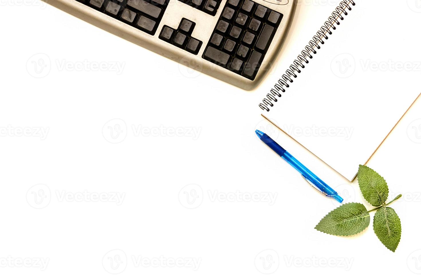 Cup of coffe and open notebook on white background photo