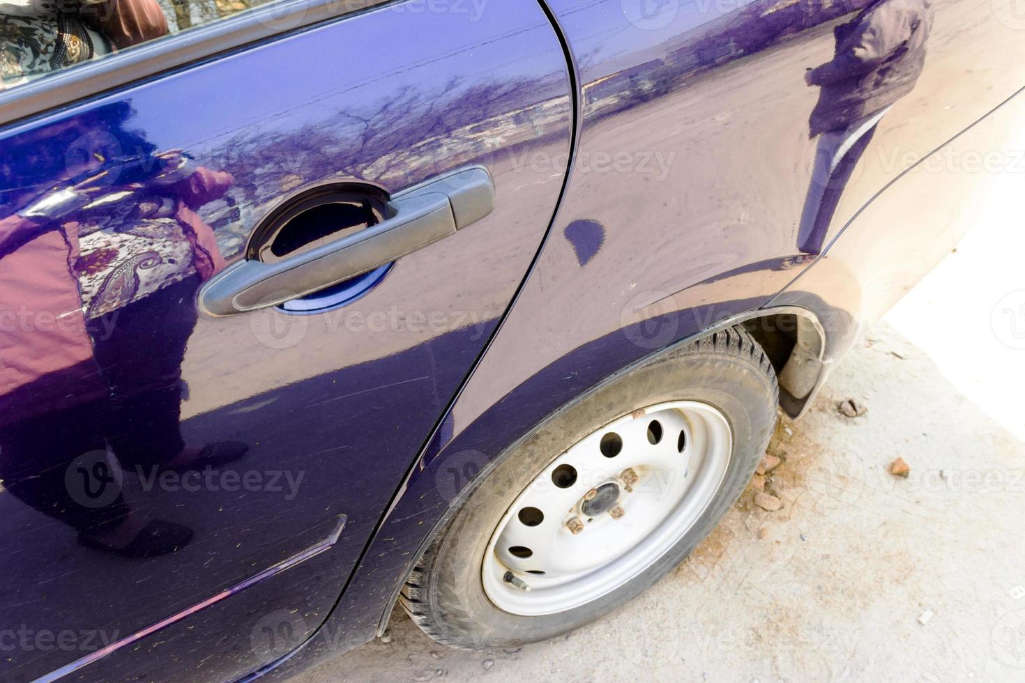car rear wheel close up outdoor day photo