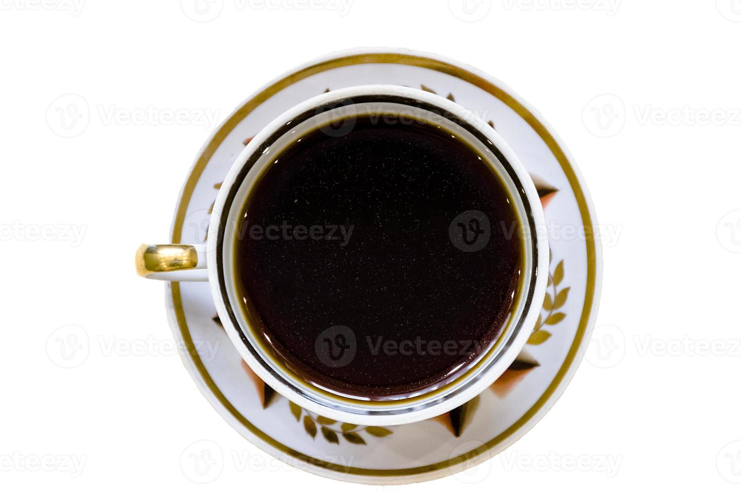 White cup of coffee on vintage wood. Top view photo