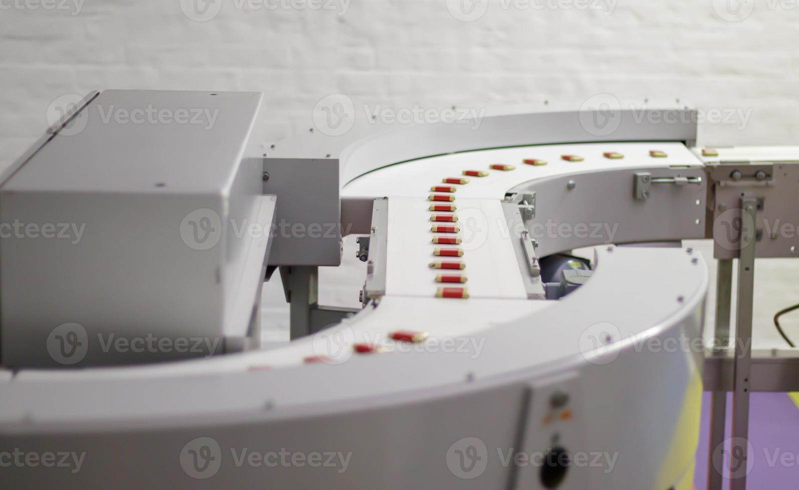 Factory for the production of sweets and chocolate. Automatic line for the production of chocolate in an industrial factory. Conveyor belt with sweets. Sweets production process. Food industry. photo