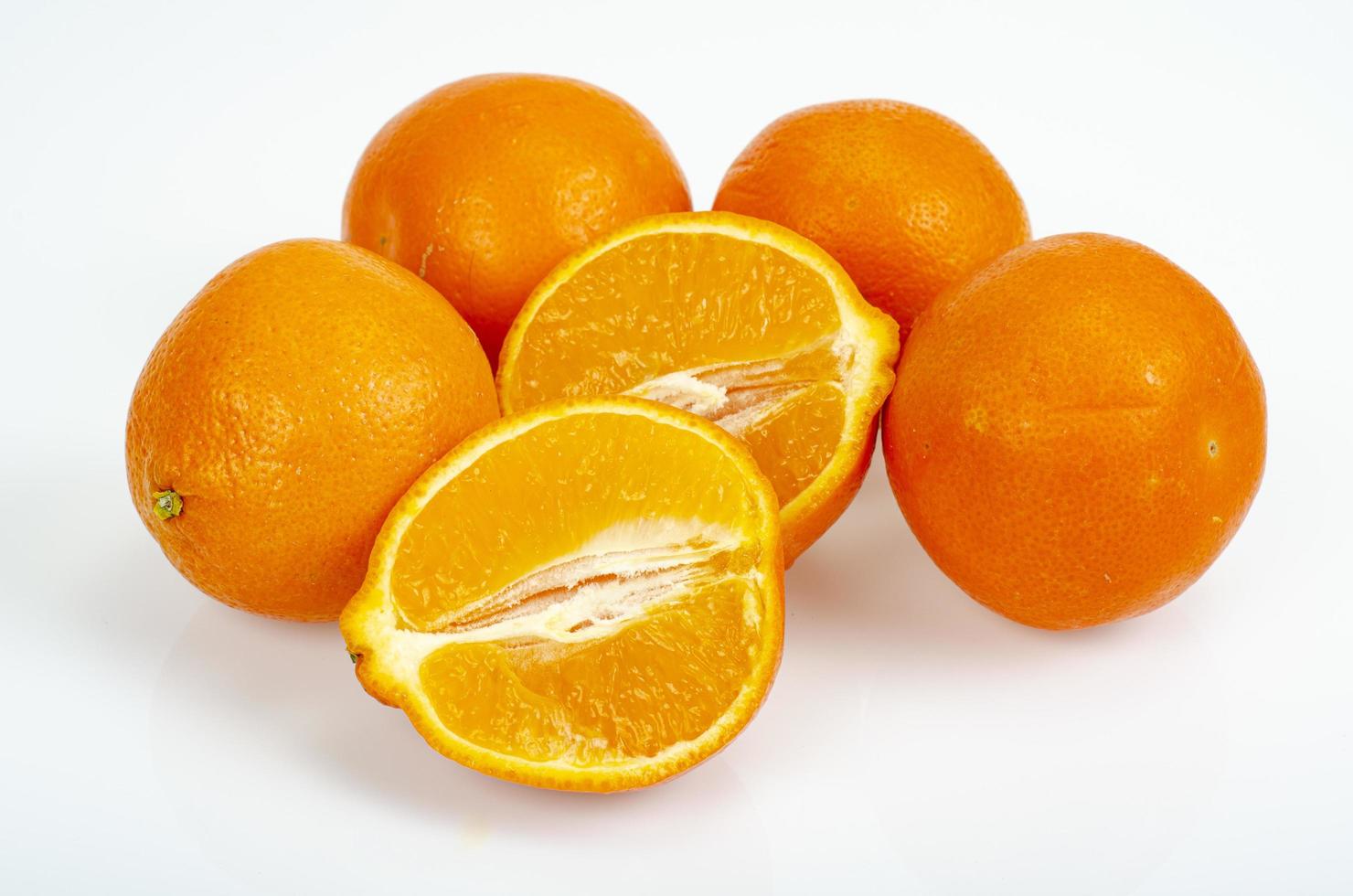 Large ripe sweet tangerines isolated on white background. Studio Photo