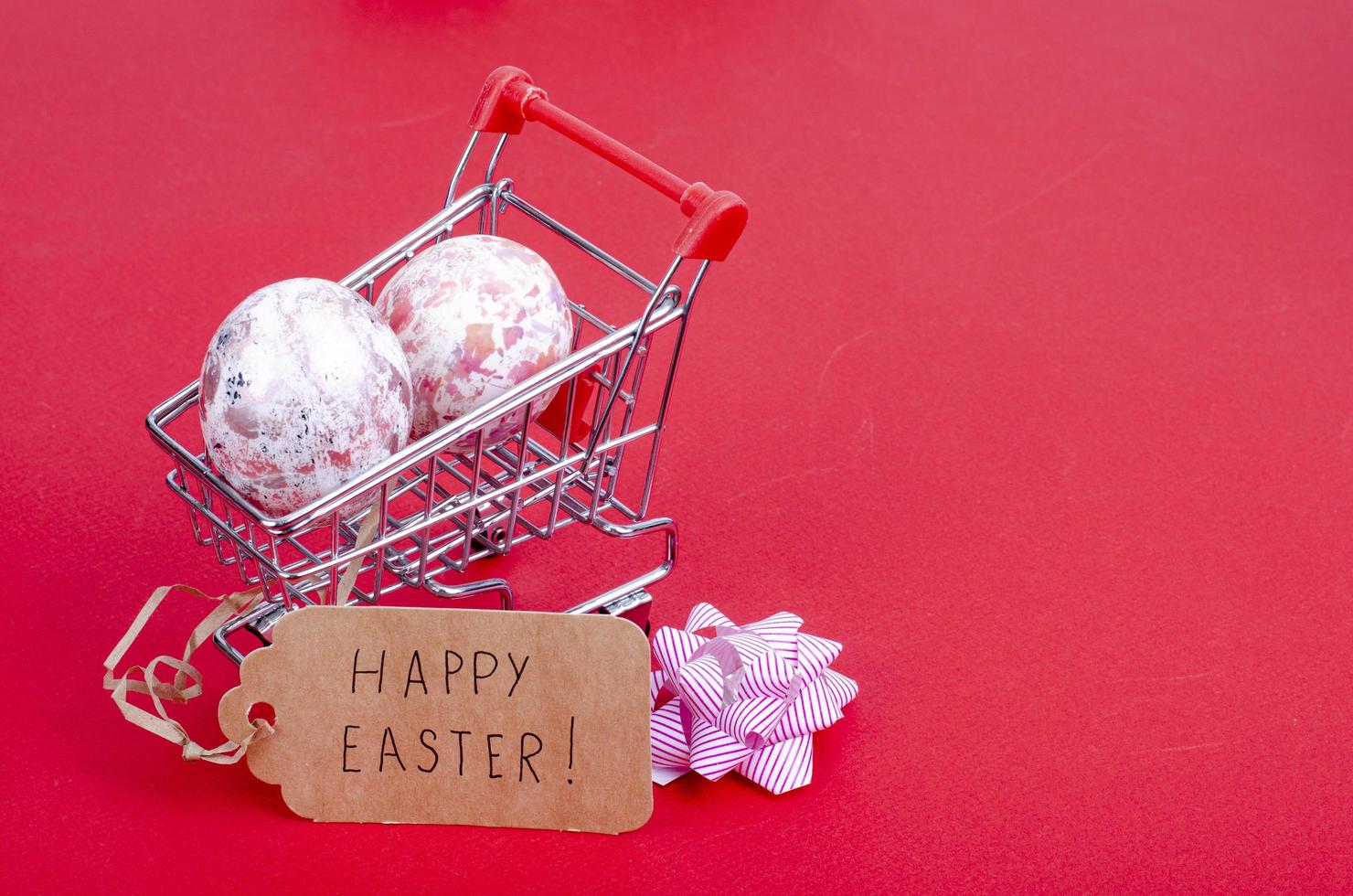 Grocery supermarket cart filled with chicken eggs. Concept of preparing for Easter, buying food. Space for text. Studio Photo