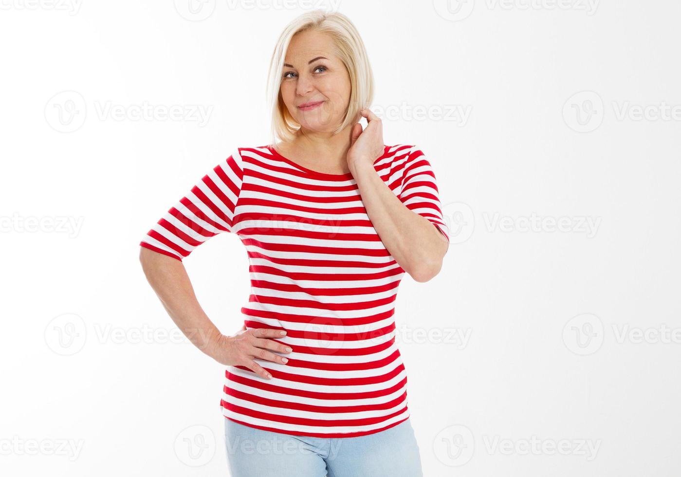 Middle-aged woman posing on white, Snap shot of a cheerful blonde, side pose. White background. photo