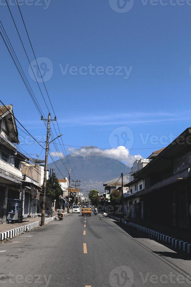 View of small town with Sindoro Mountain background in Parakan, Temanggung, Indonesia. Temanggung, Indonesia - December, 2020 photo