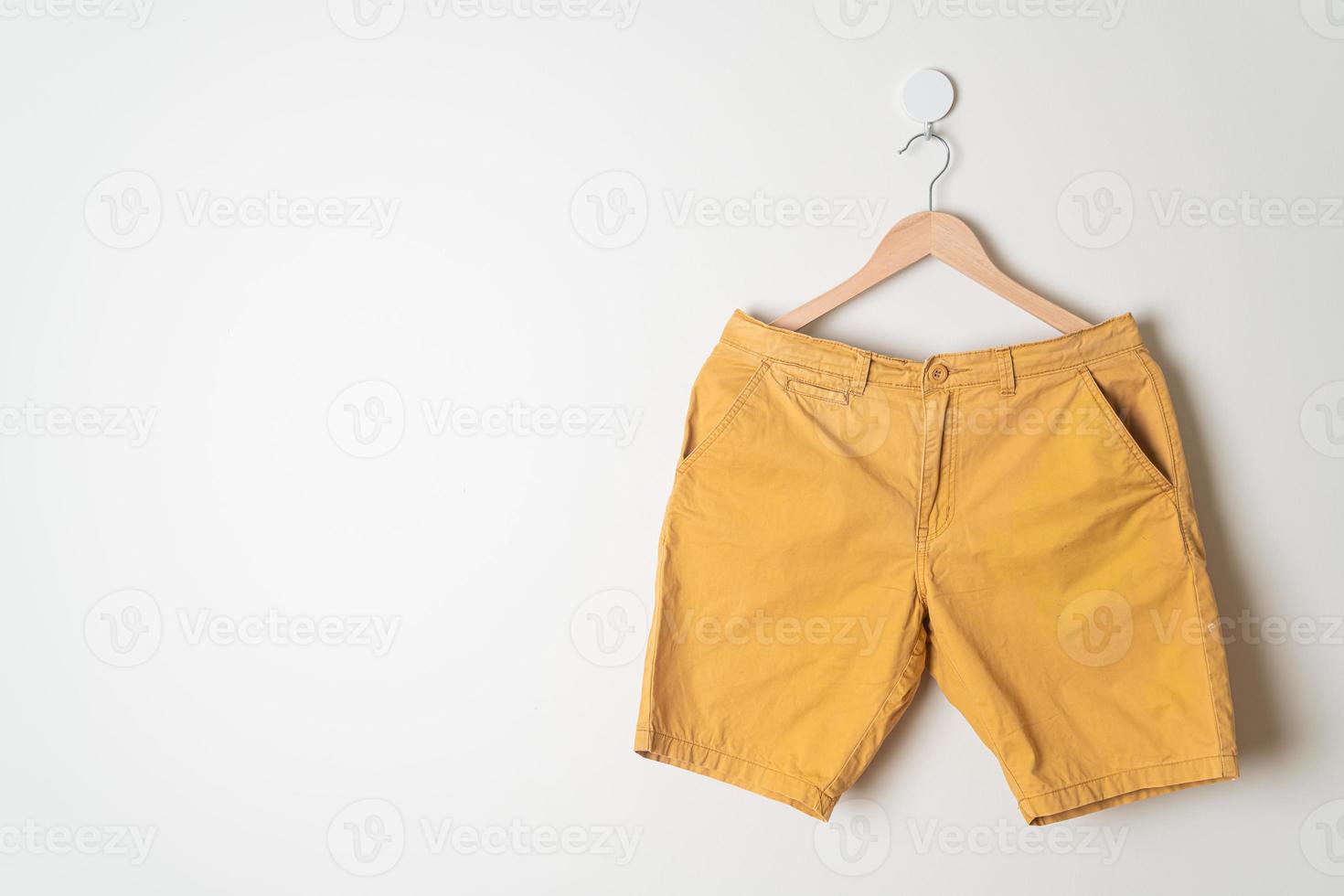 short pants hanging on wall photo