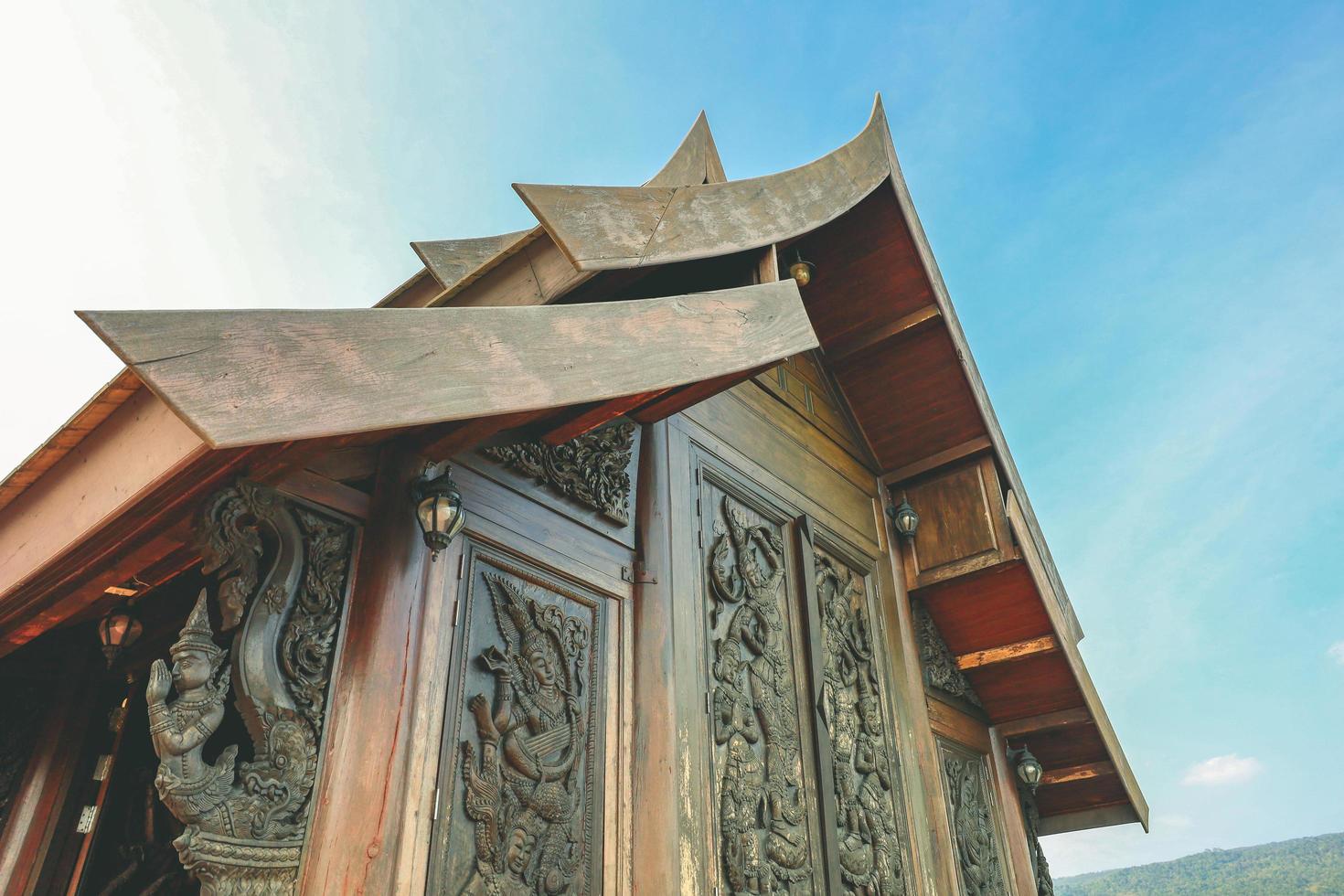 Loei, Thailand 12,2021 Wat Somdet Phu Ruea Ming Mueang Temple. The temple is built with fine wood timber. The church is made of teak and locate on mountain and one of top viewpoint at Phu ruea. photo