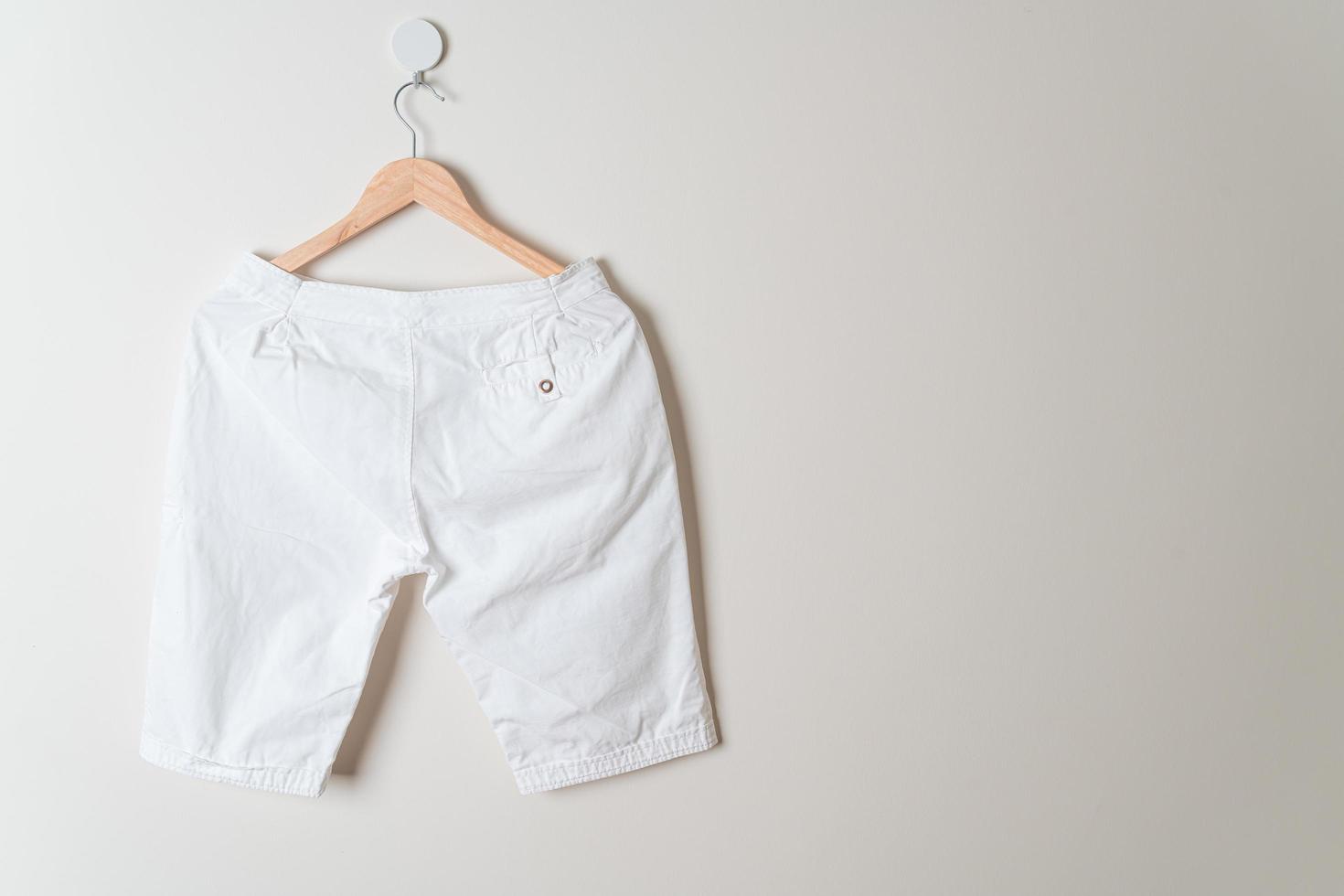 short pants hanging on wall photo