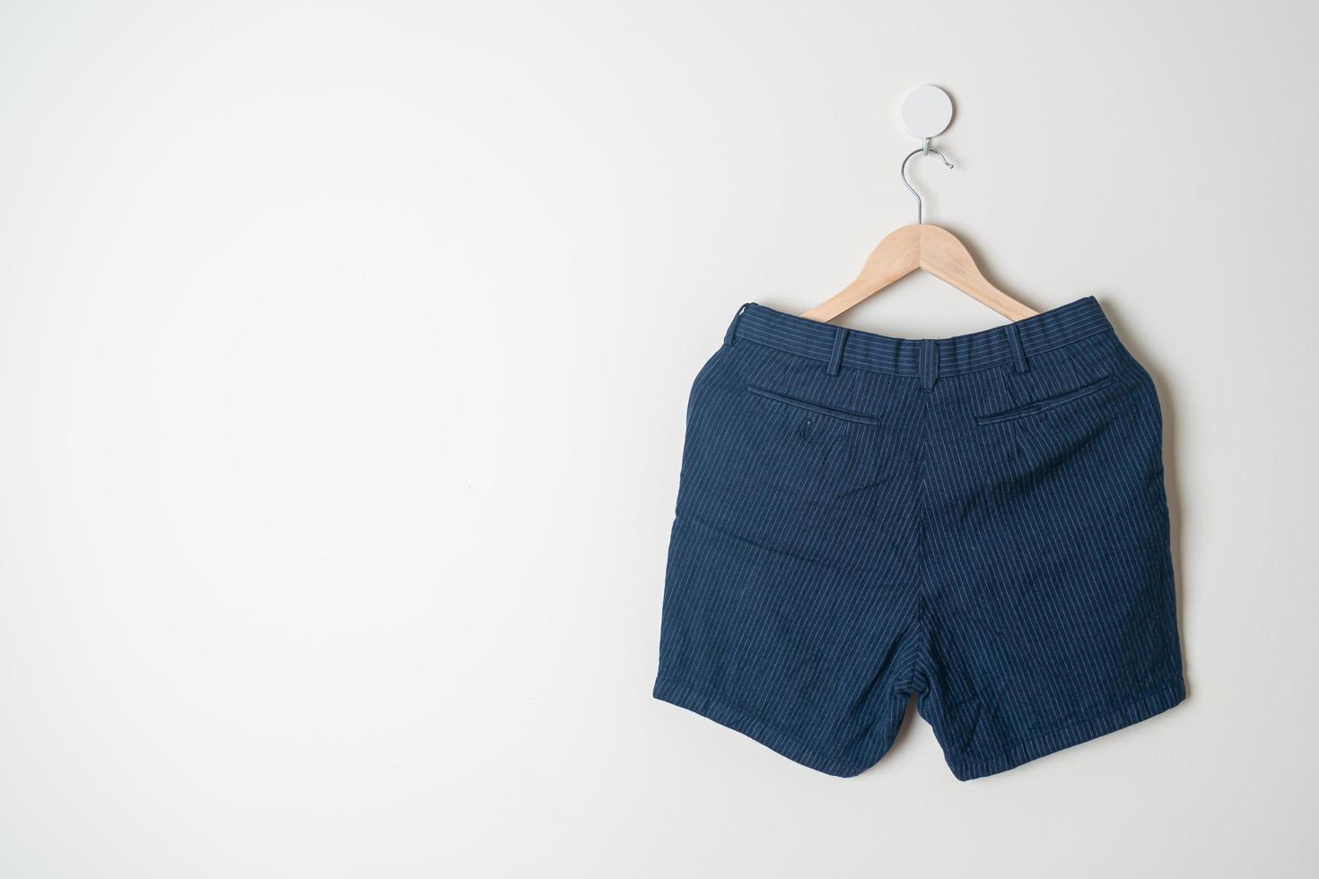 short pants hanging on wall photo