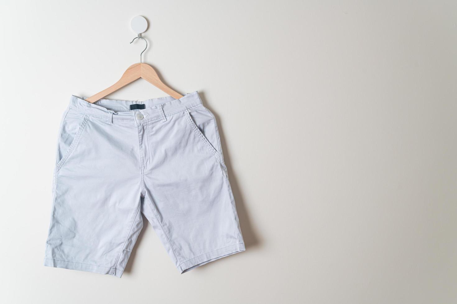 short pants hanging on wall photo