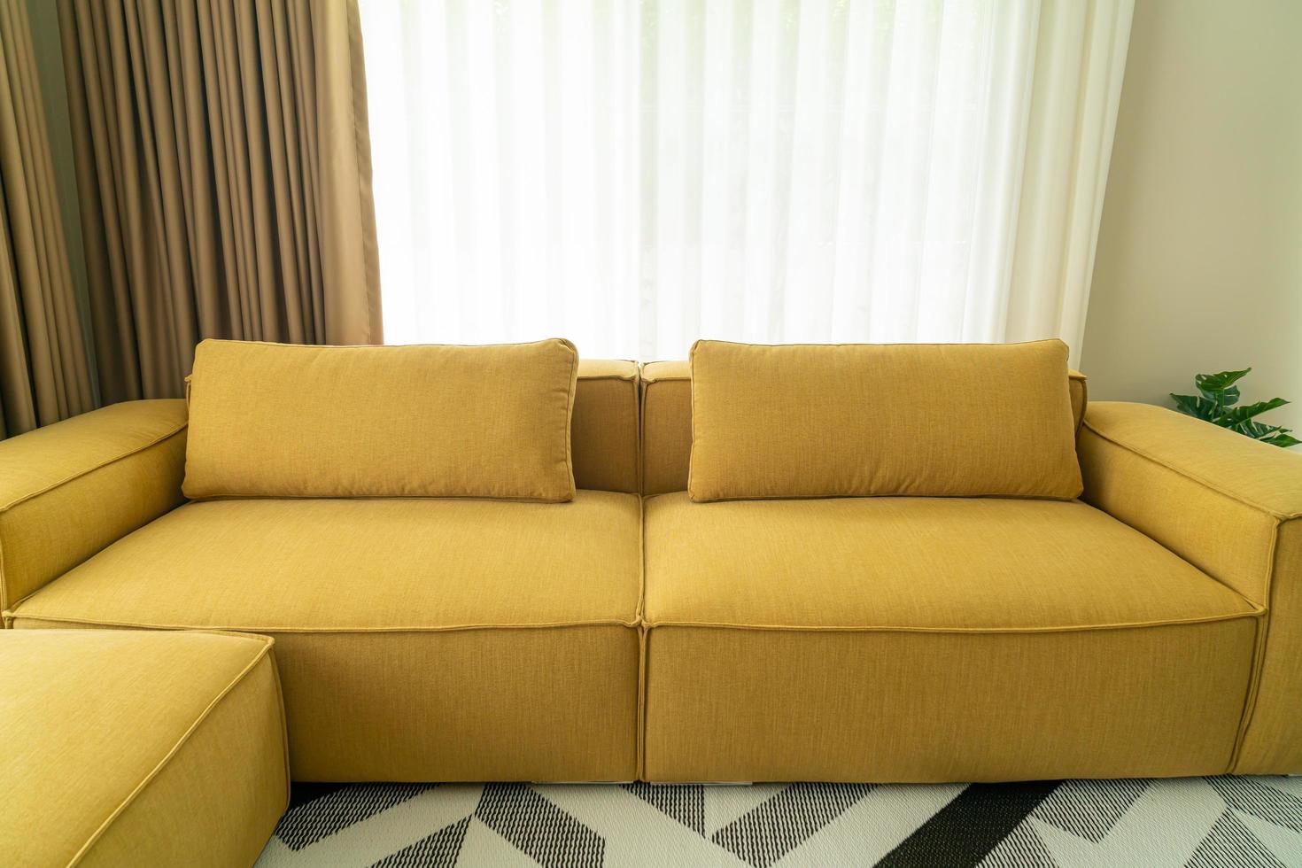 empty yellow fabric sofa in living room photo