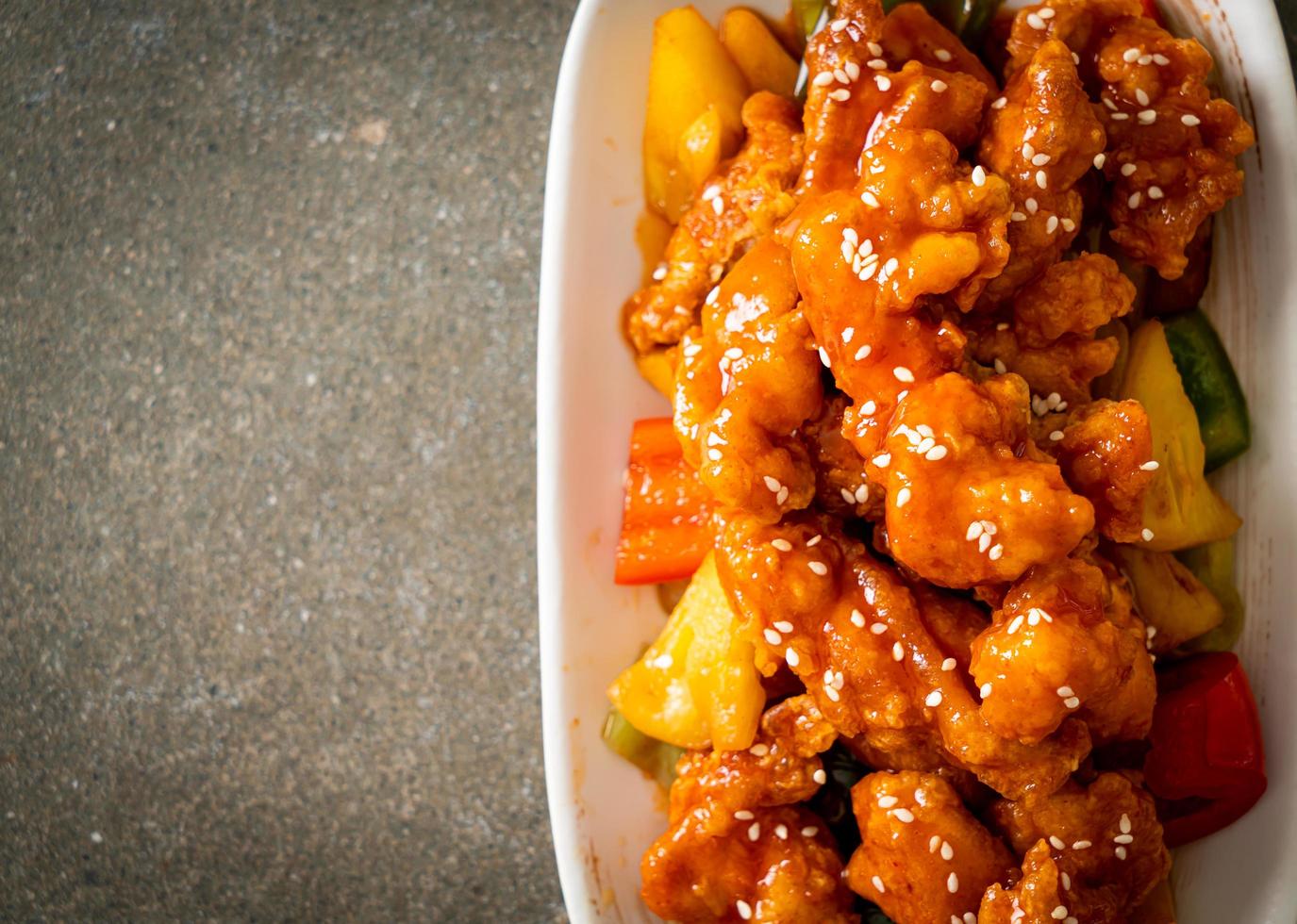 fried crispy chicken with sweet and sour sauce photo