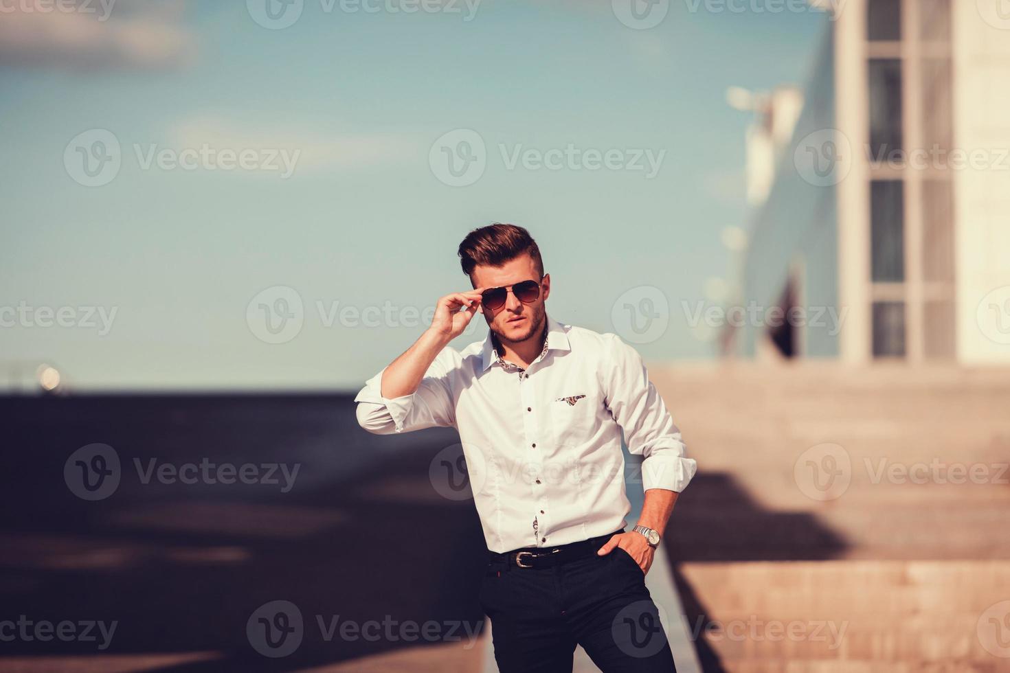 young man in sunglasses photo