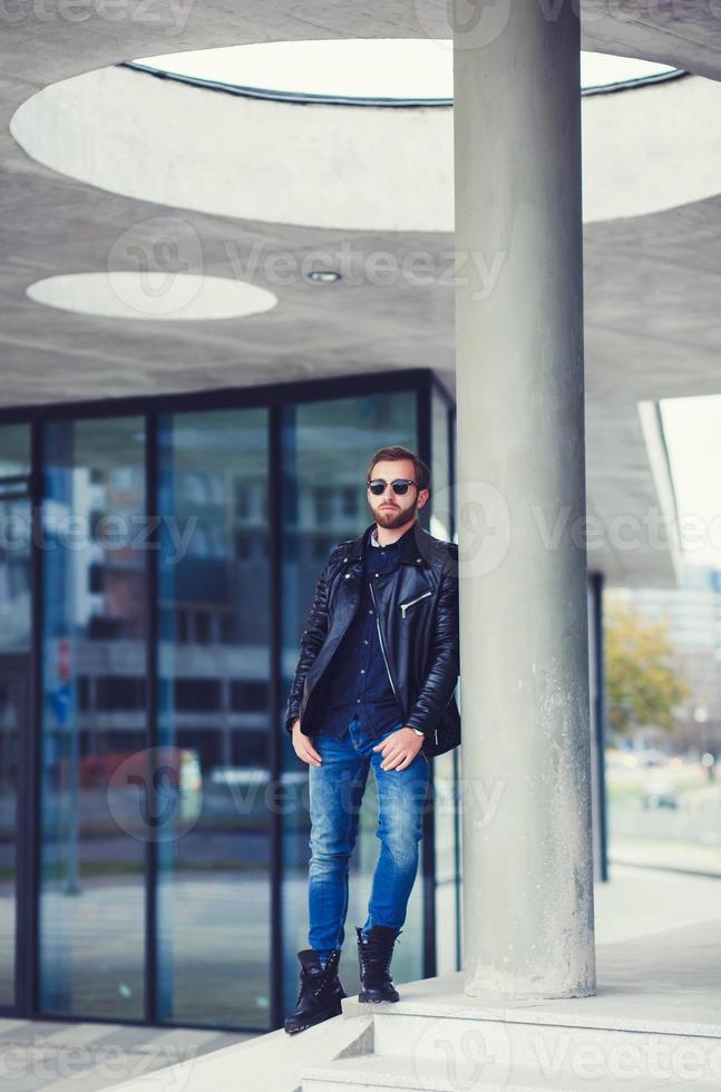 Man standing in street photo