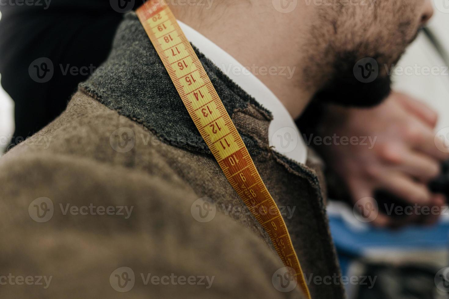 man with measuring tape photo