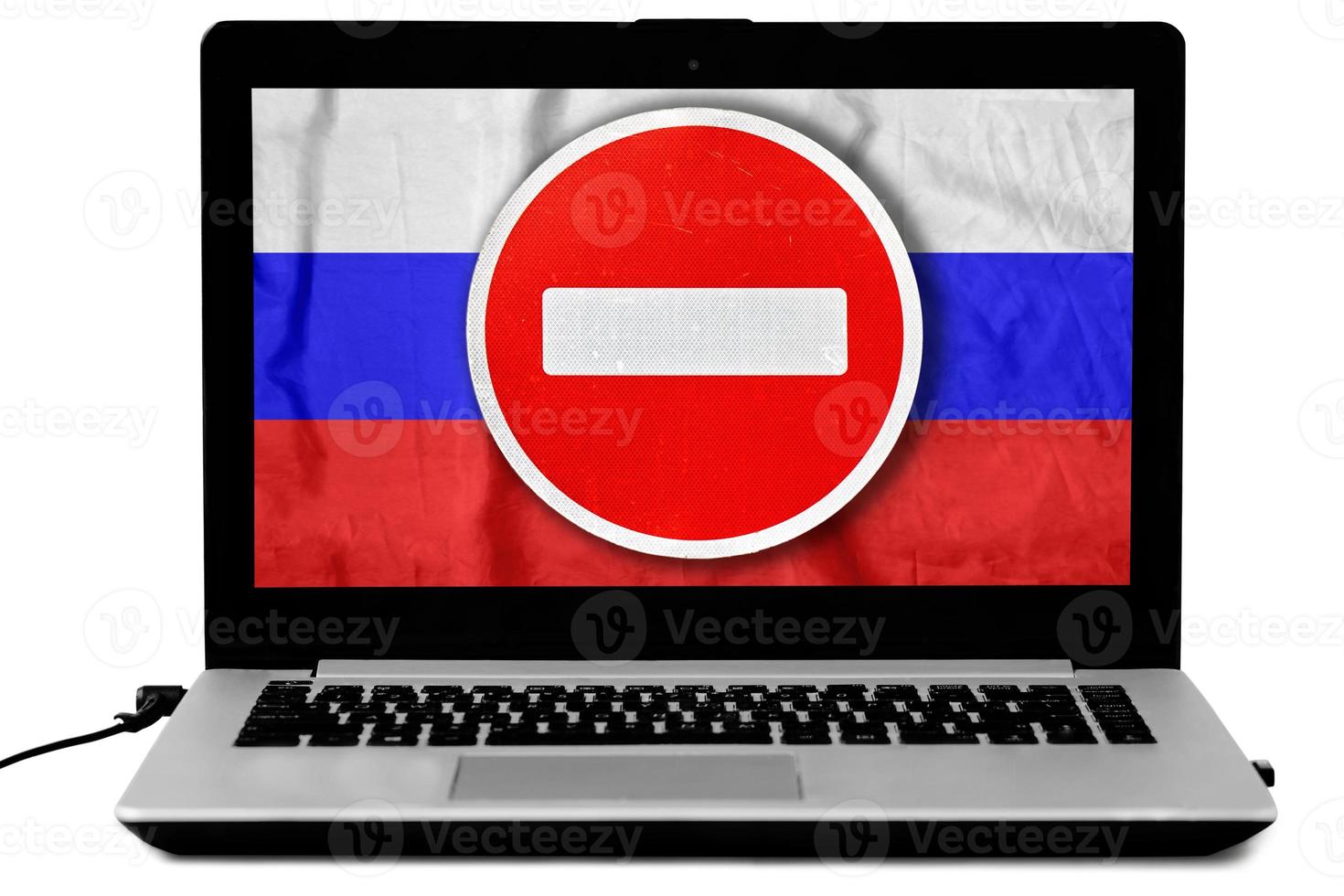 Laptop with a do not enter sign and a russian flag on the screen isolated on white. photo