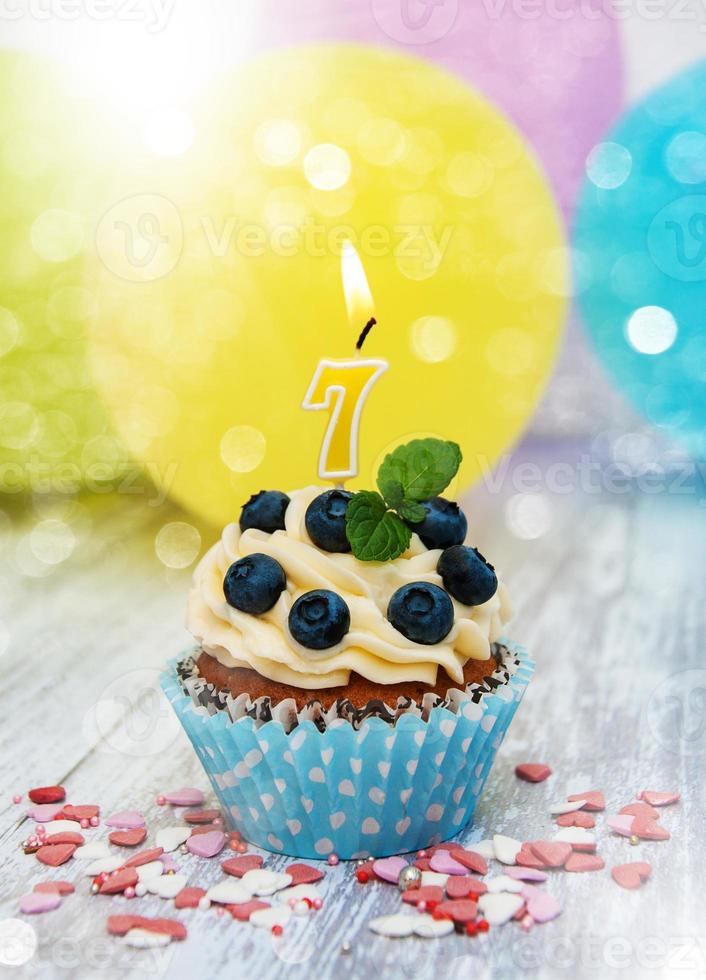 Cupcake with a numeral seven candle photo