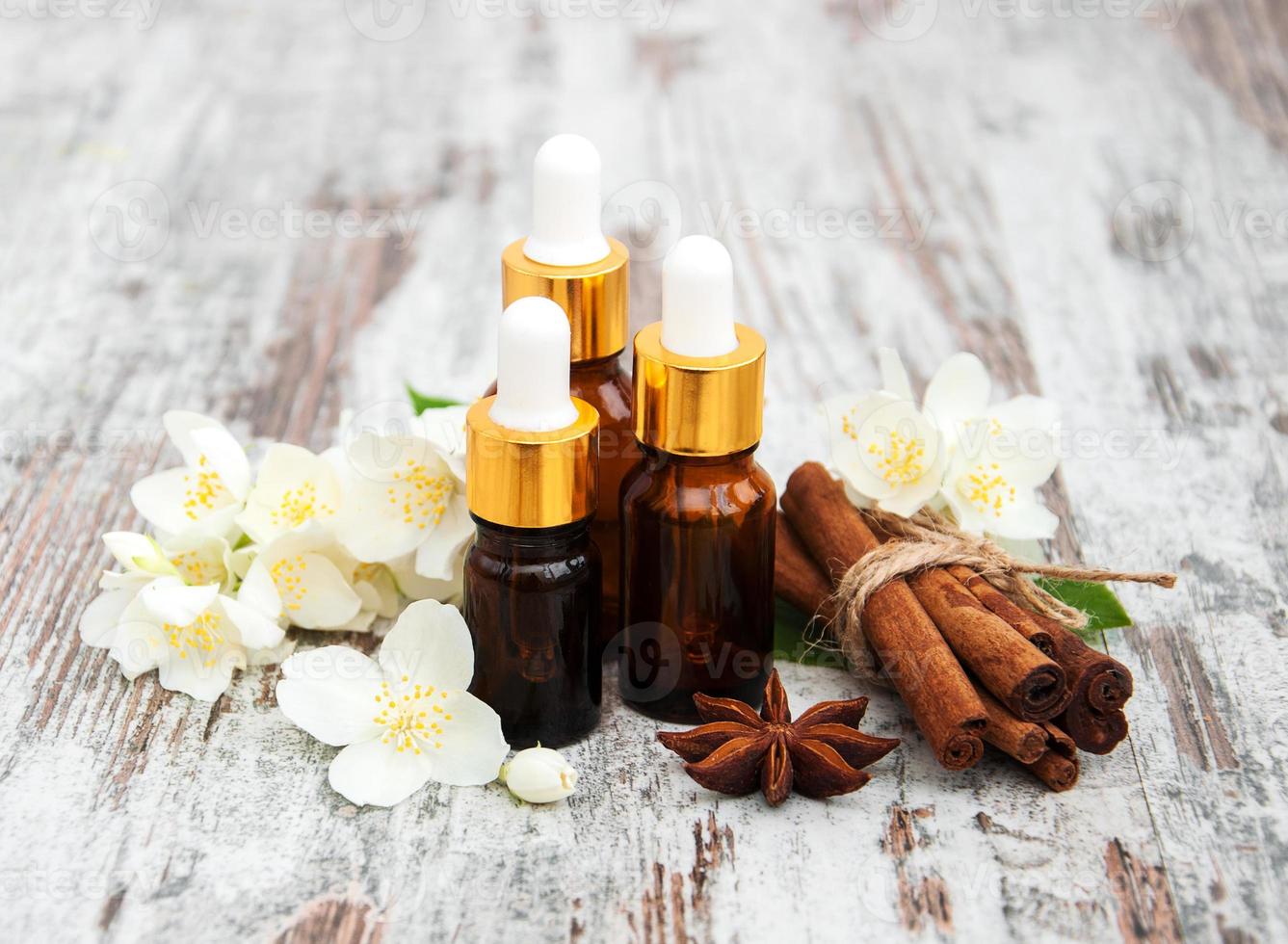 Massage oils and jasmine flowers photo