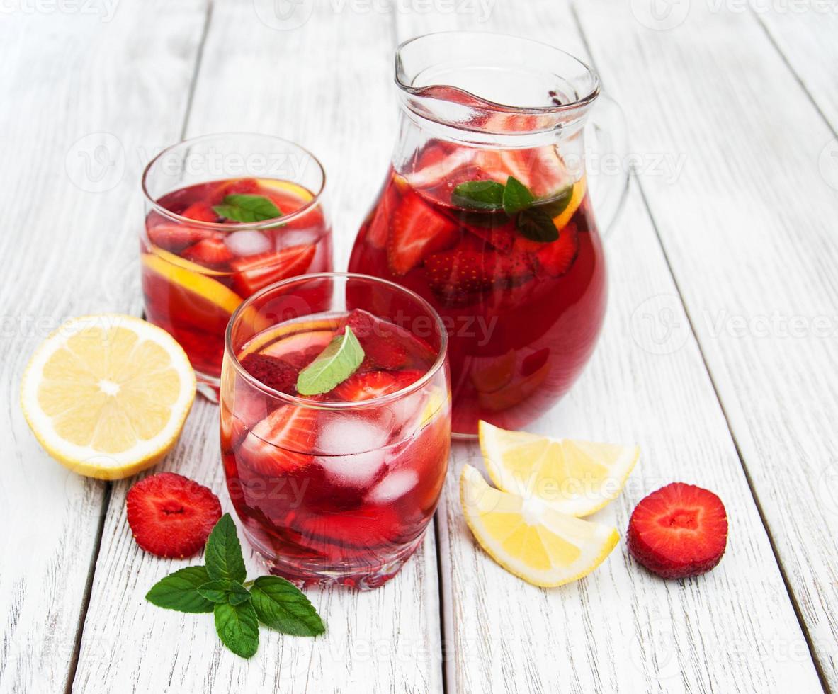 Glasses of lemonade with strawberries photo