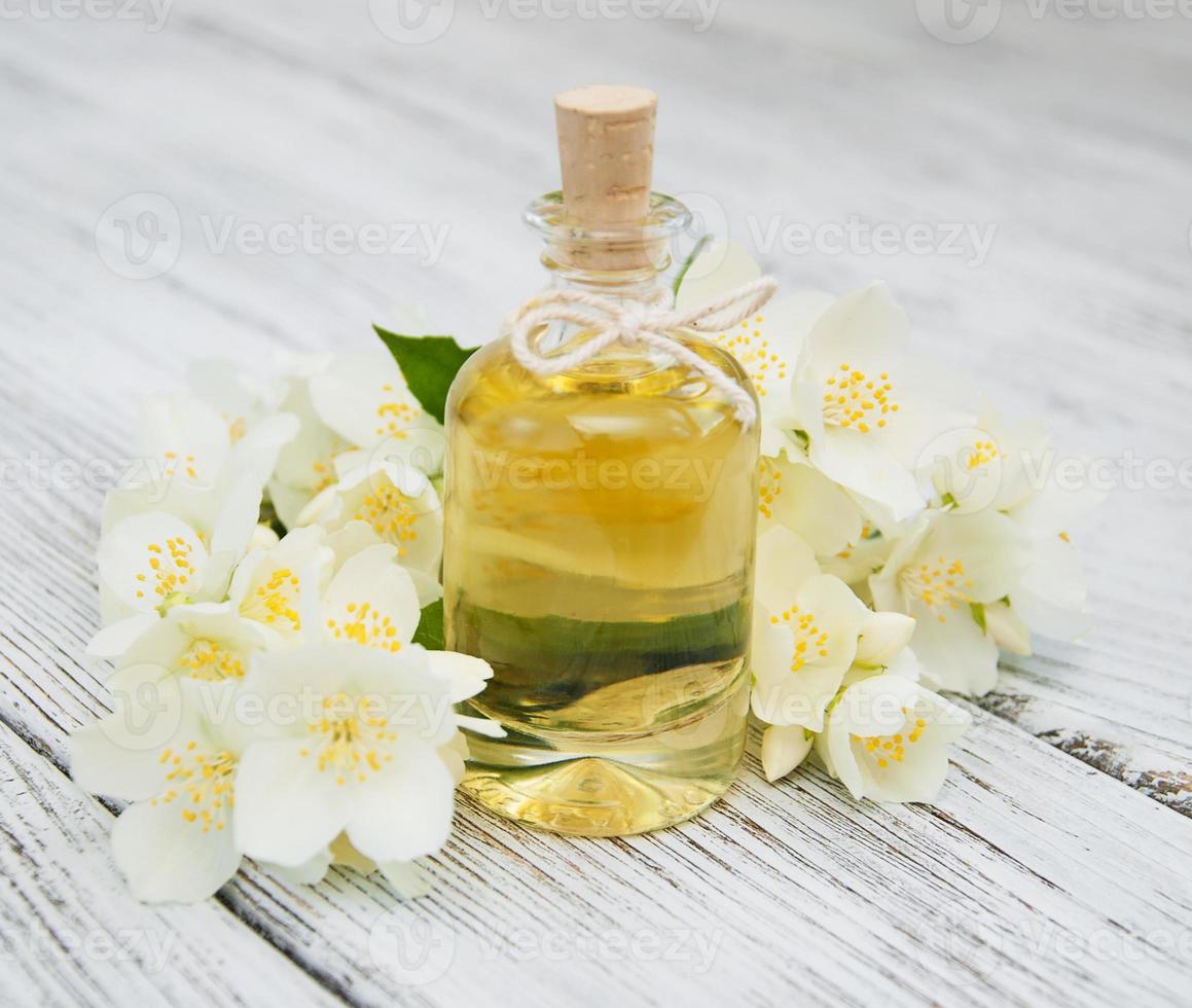 Massage oil with jasmine flowers photo