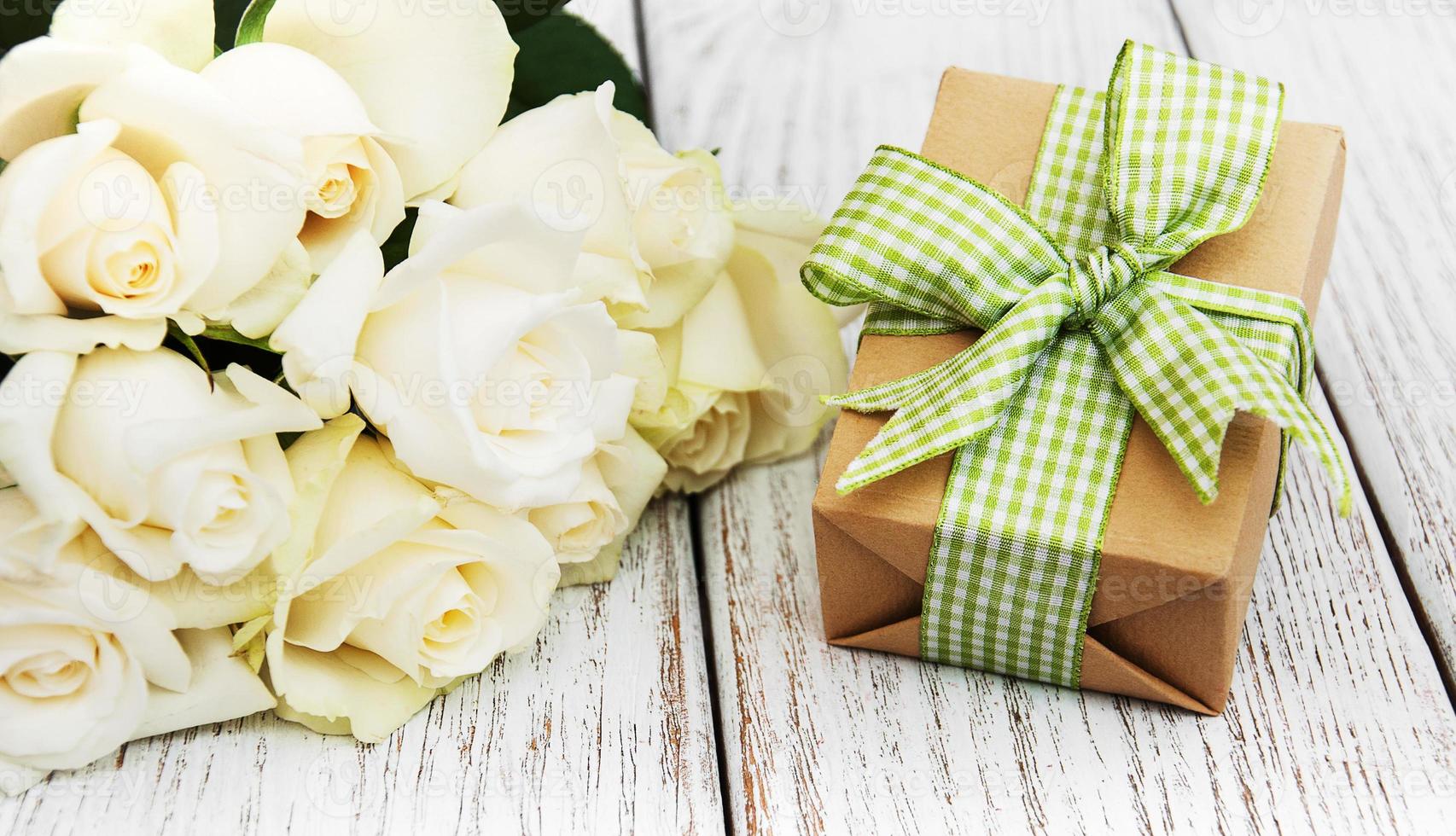 White roses and gift box photo