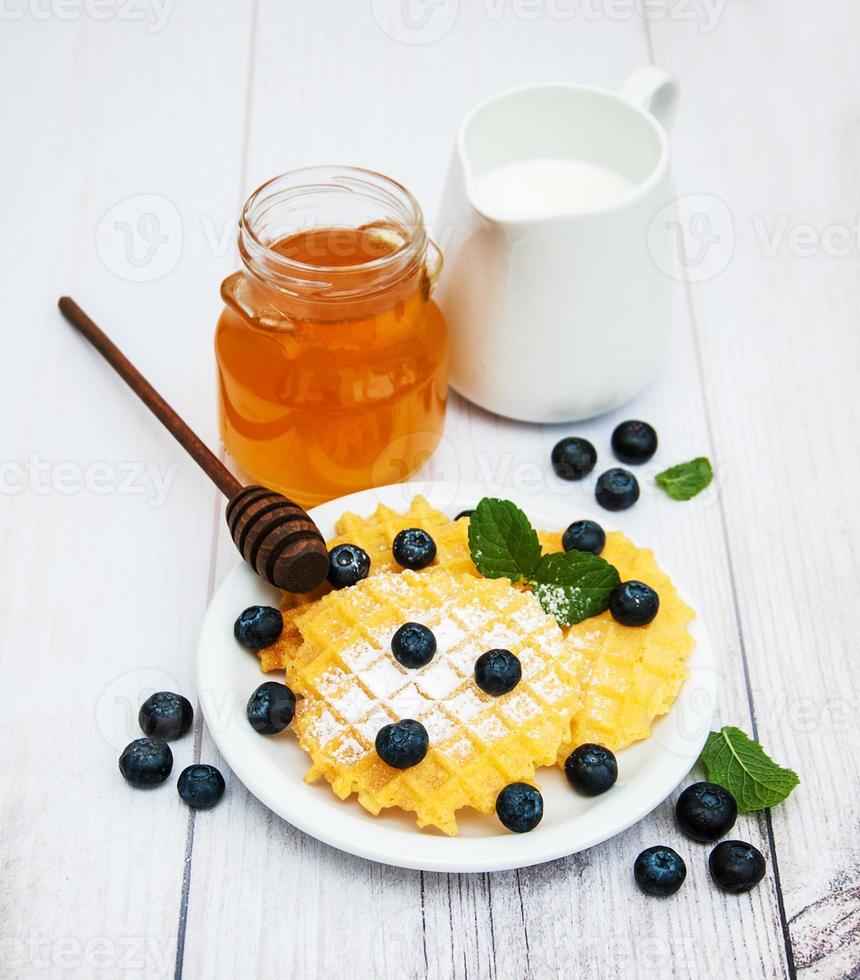 Waffles with blueberries photo