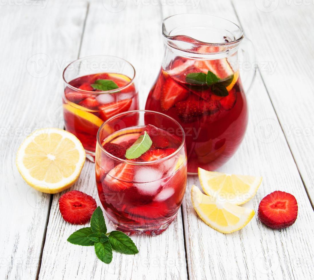 Glasses of lemonade with strawberries photo