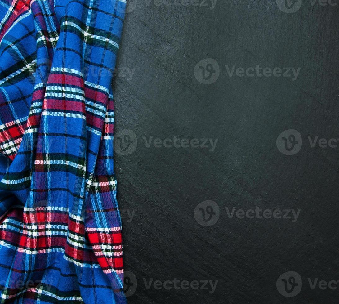 Checkered napkin on a black background photo