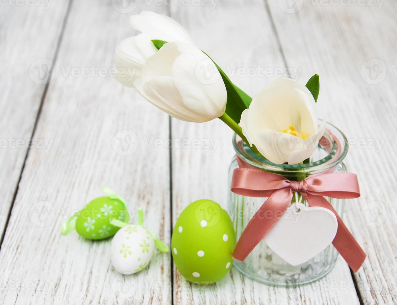 Easter eggs and tulips photo