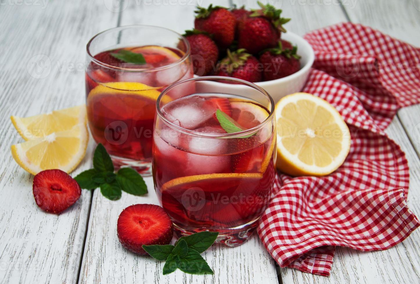 Glasses of lemonade with strawberries photo