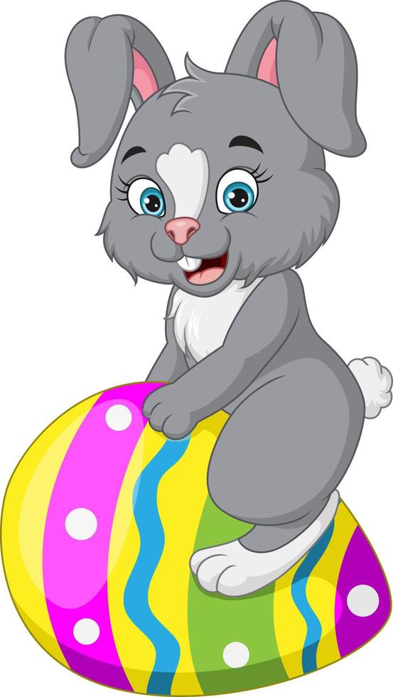 Cute little bunny sitting on easter egg vector