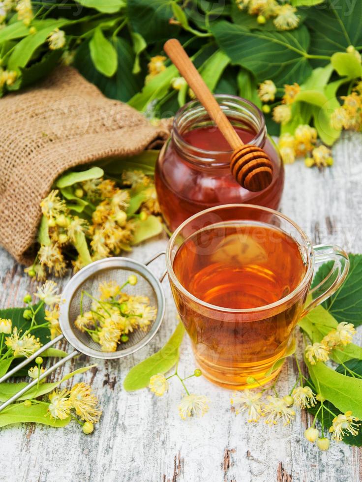 cup of herbal tea with linden flowers photo