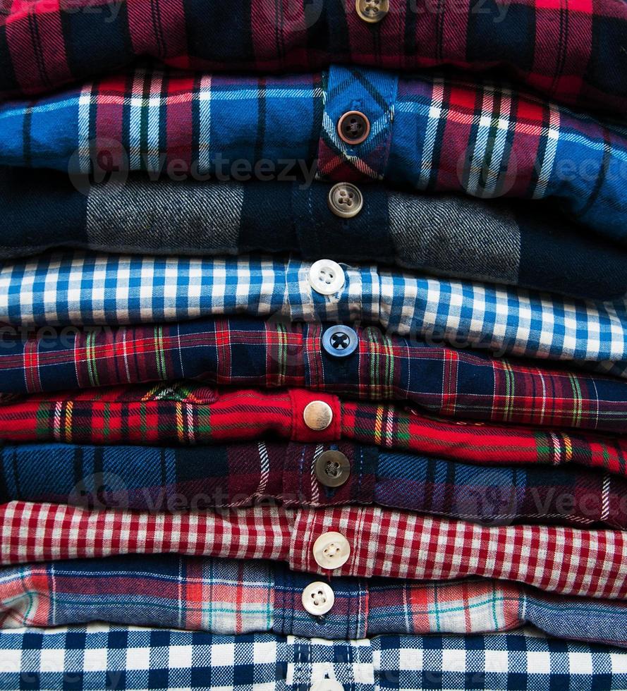 stacks of checkered shirts photo