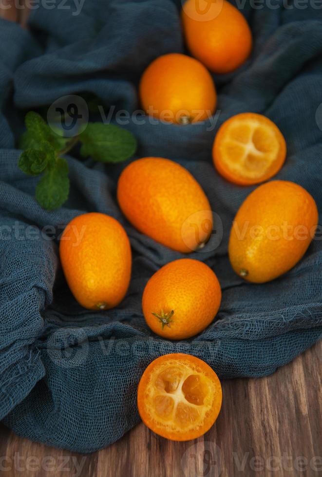 Kumquats on a textile napkins photo