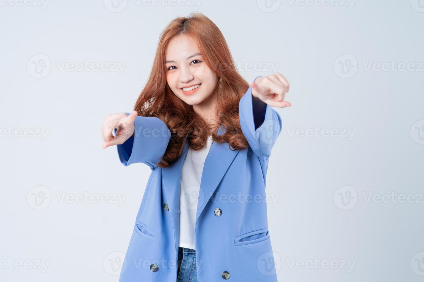 Young Asian woman posing on white background photo