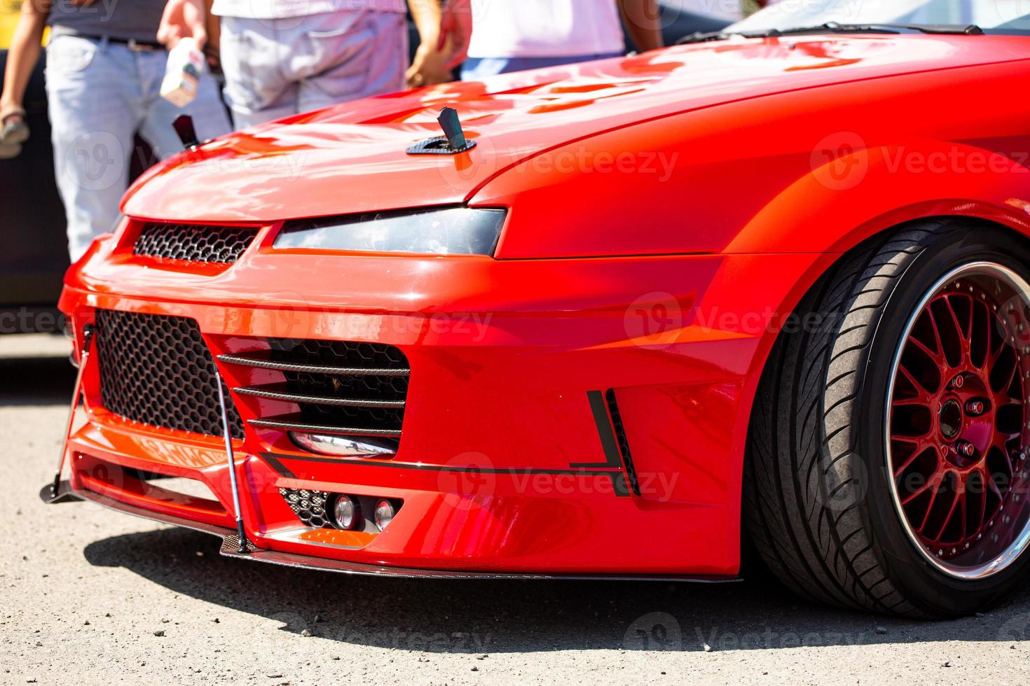 Red sports tuning car close-up, side view photo