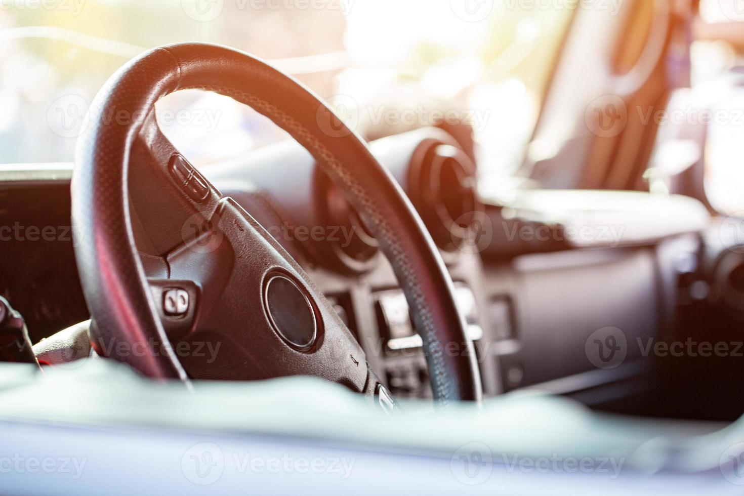 Leather black steering wheel in the car photo