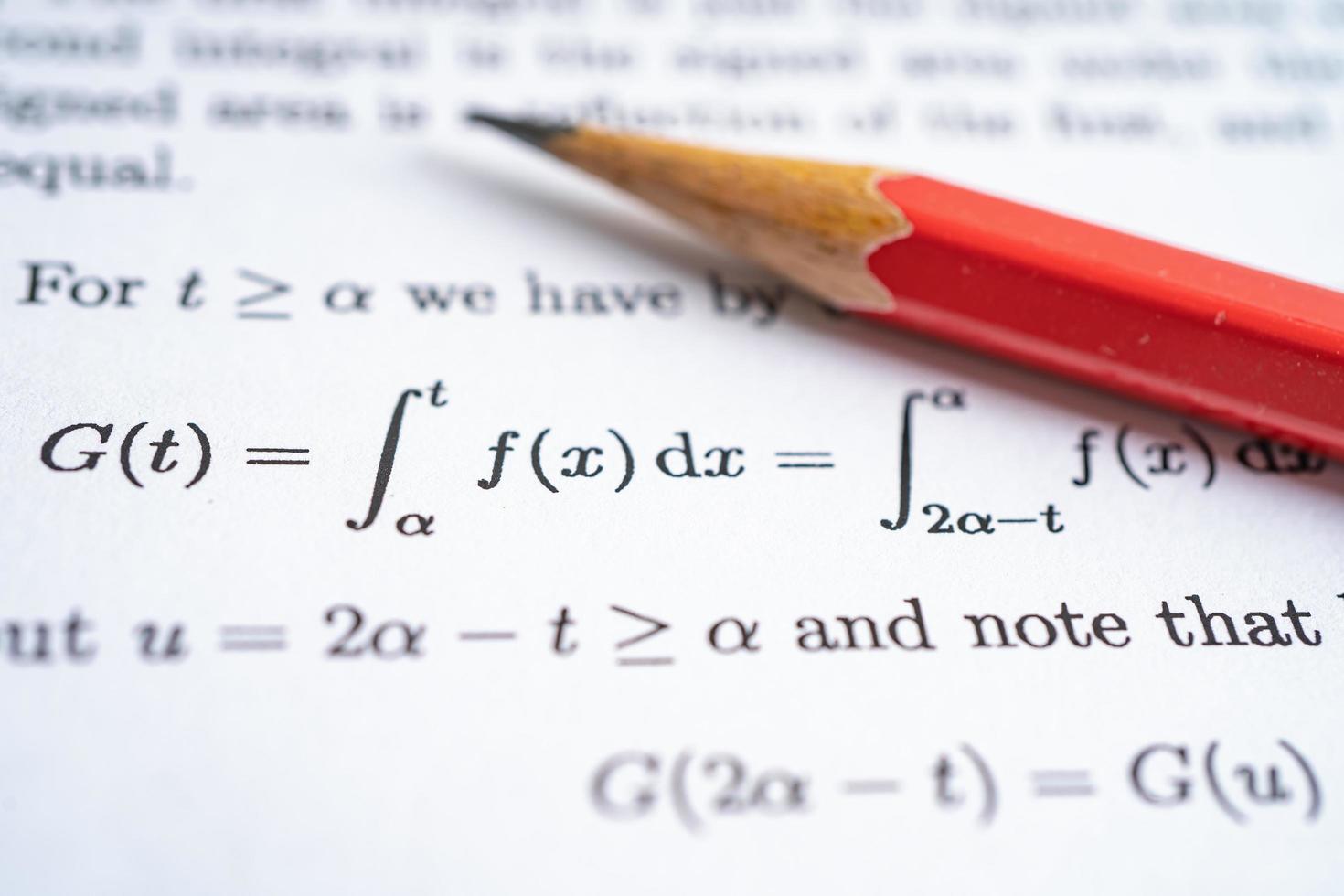 Pencil on mathematic formula exercise test paper in education school. photo