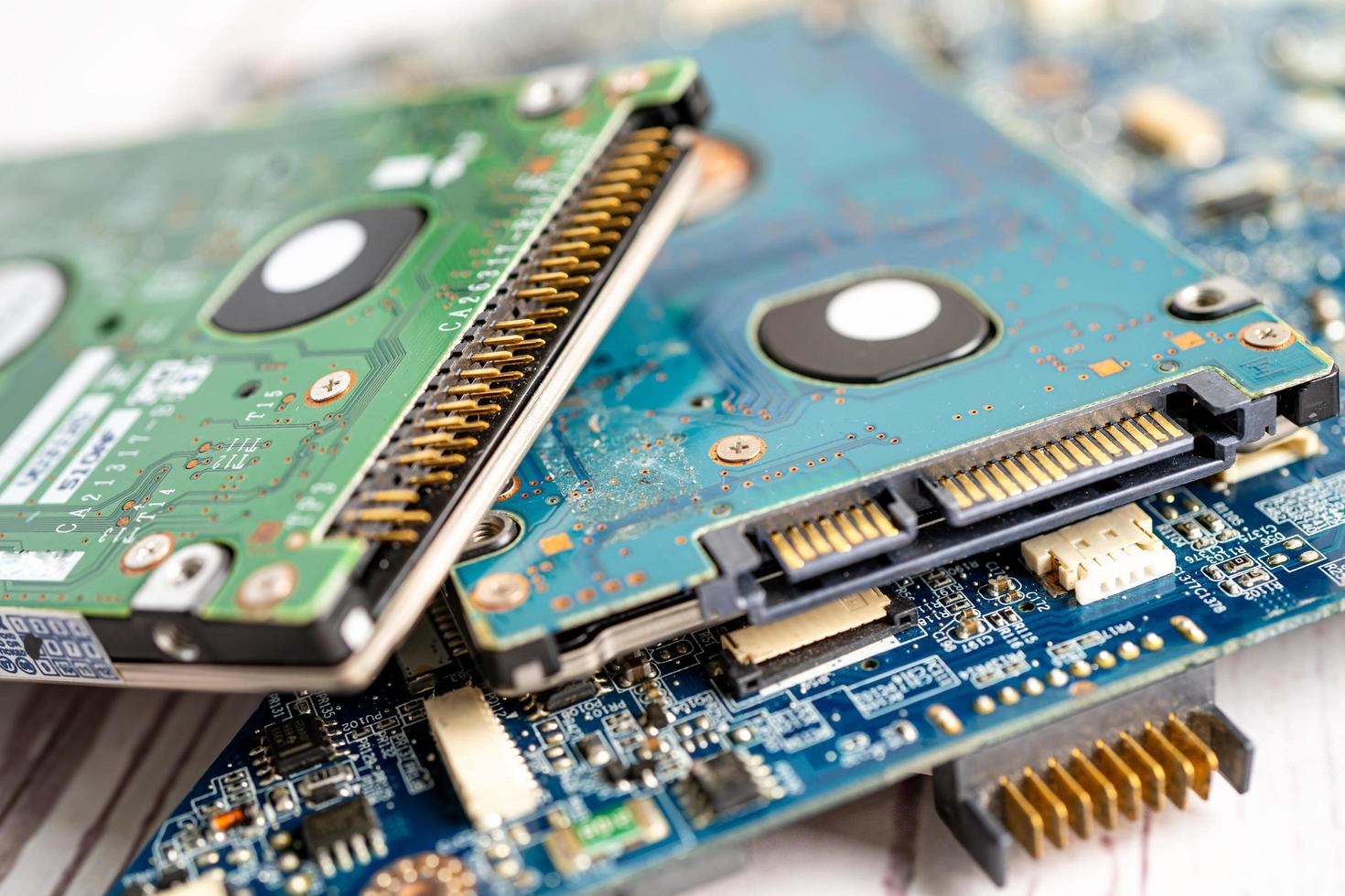 Technician repairing inside of mobile phone by soldering iron. Integrated Circuit. the concept of data, hardware, technology. photo