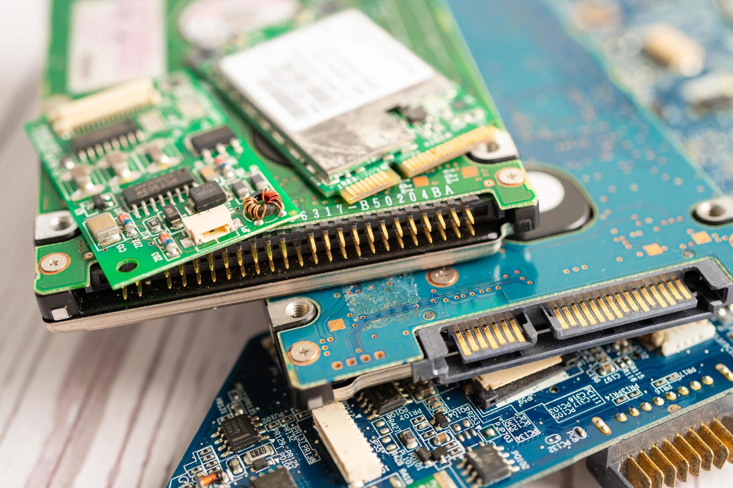 Technician repairing inside of mobile phone by soldering iron. Integrated Circuit. the concept of data, hardware, technology. photo