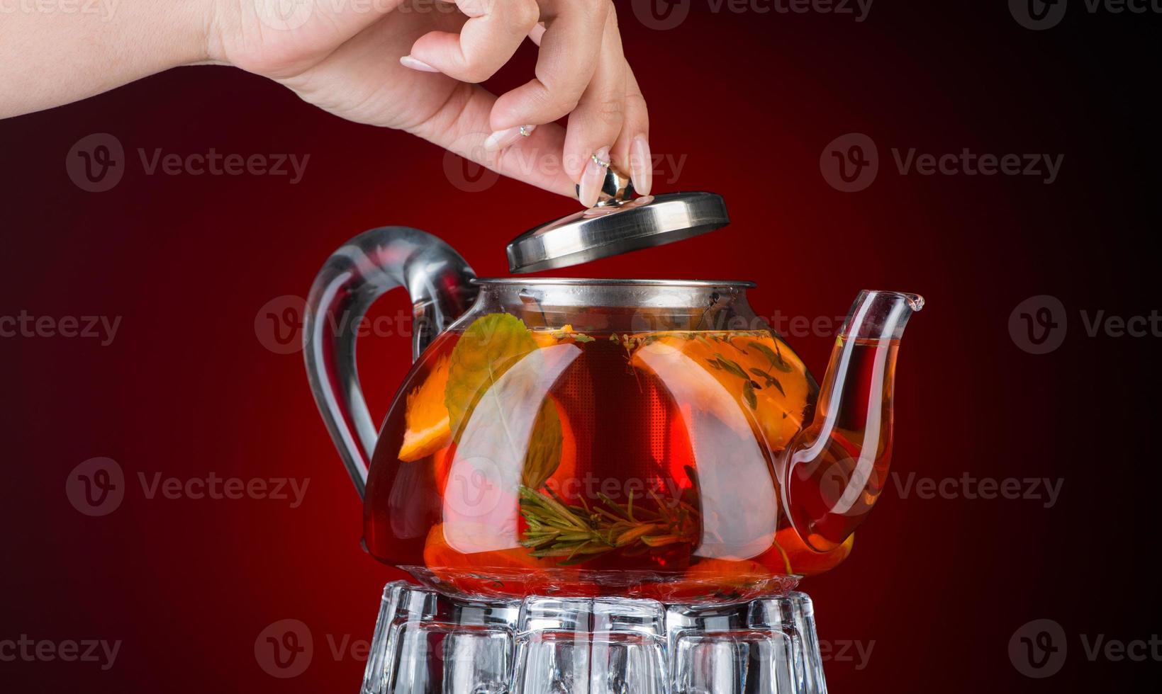 Mint tea in a transparent teapot photo