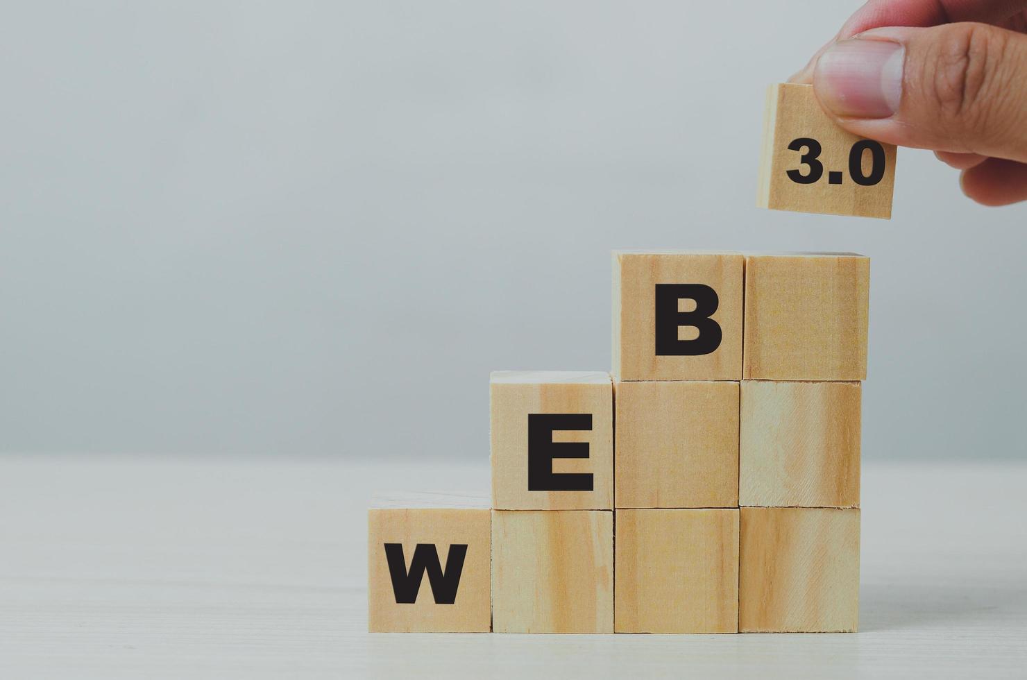 Wooden cubes with WEB 3.0 symbol on background and copy space.Business concepts. photo