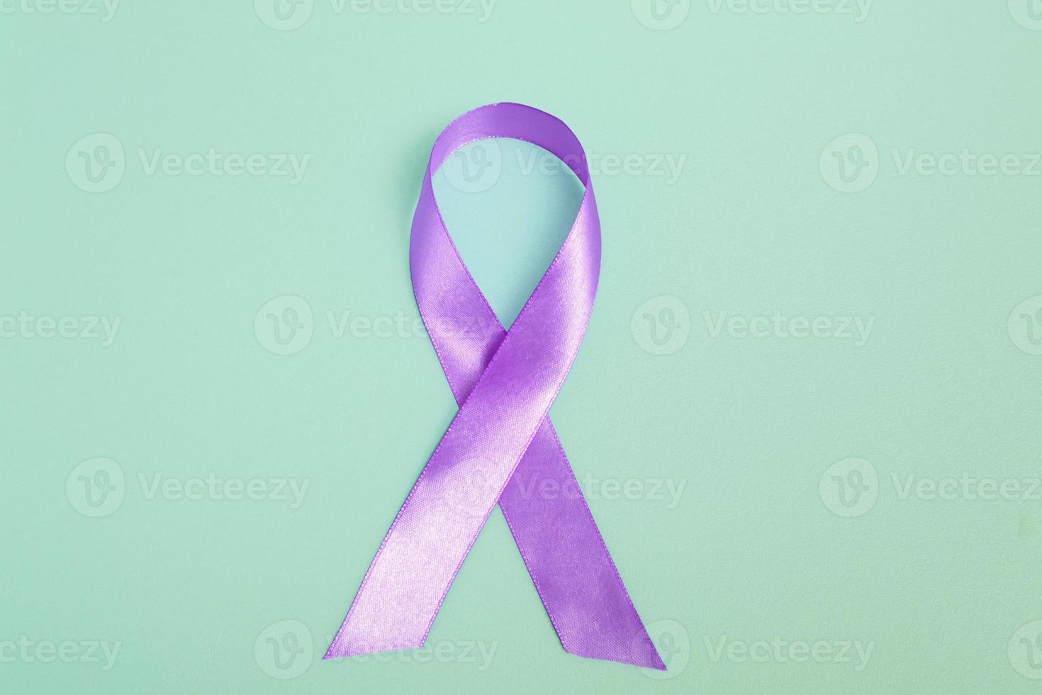 Closeup purple ribbon on a blue background with copy space. World epilepsy day.Banner photo