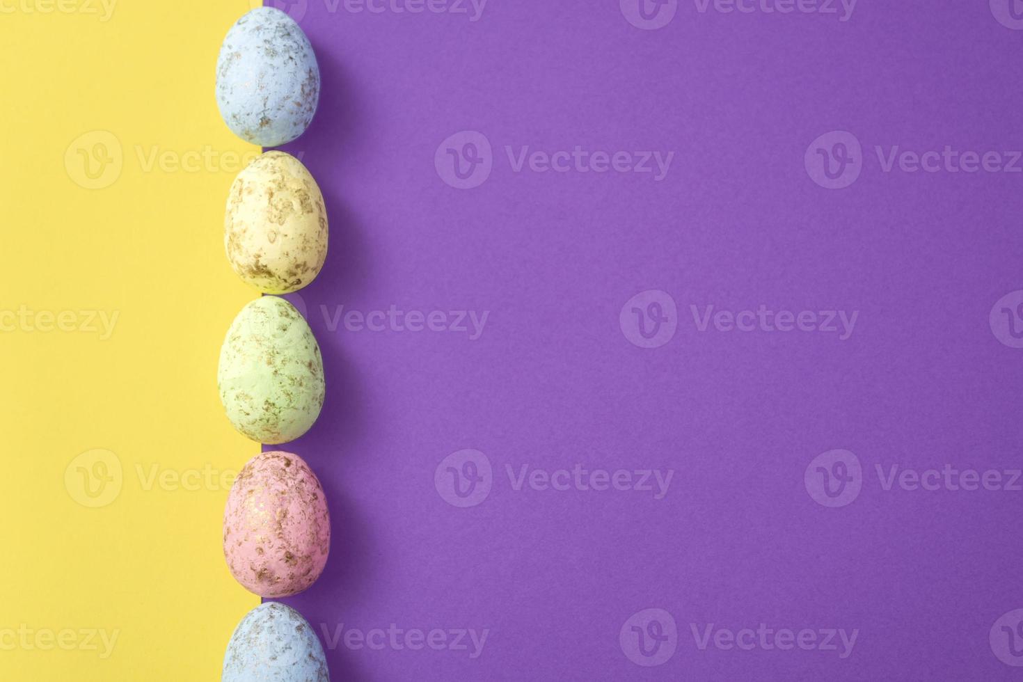 Easter eggs on a colored background. Festive banner with copyspace photo